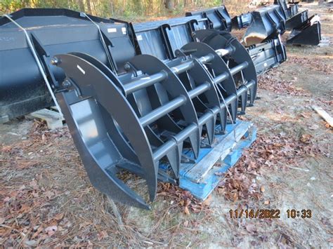 skid steer impl|attachments for a skid steer.